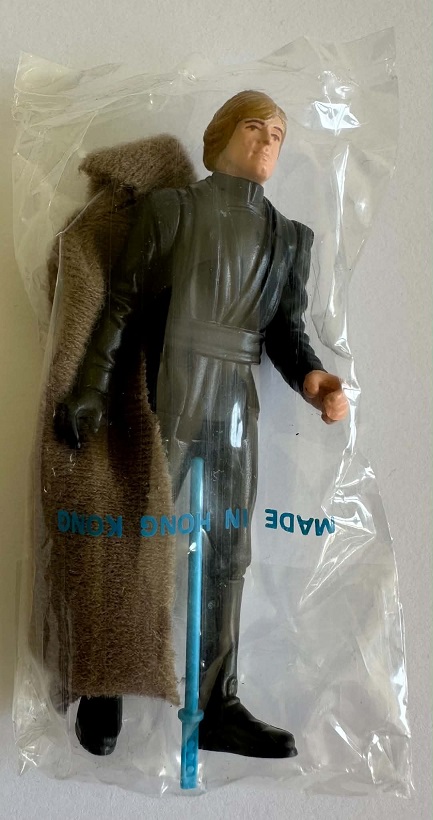 Palitoy-A Smile HK Luke Jedi baggie with Blue Sabre 1.jpg